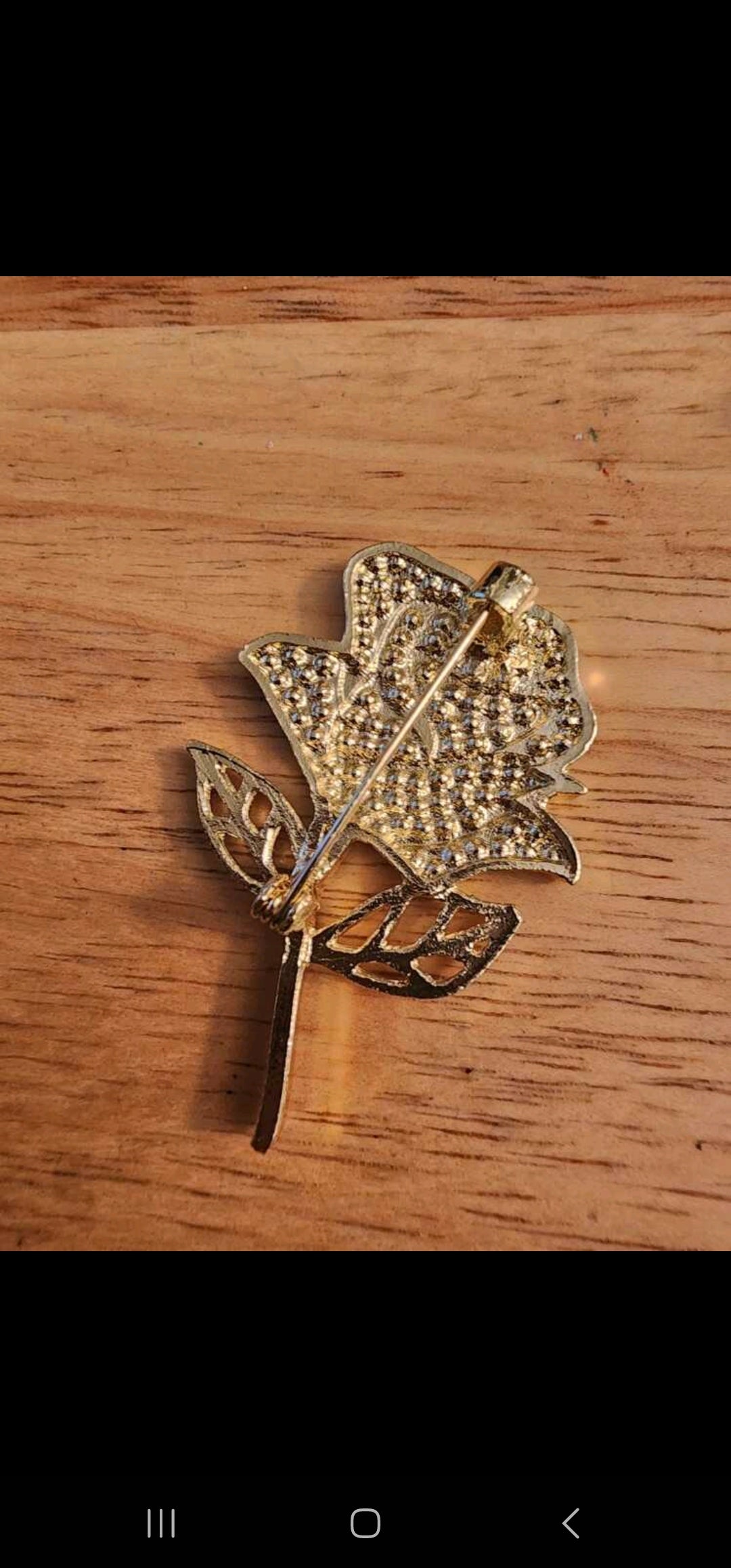 Gold flower brooch